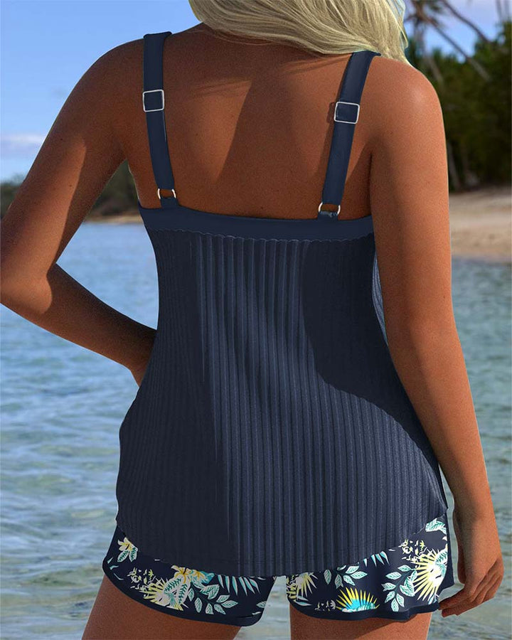 Ribbed tie-front sweetheart tankini top, paired with tropical print shorts. Womens modest swimsuit for resort wear.