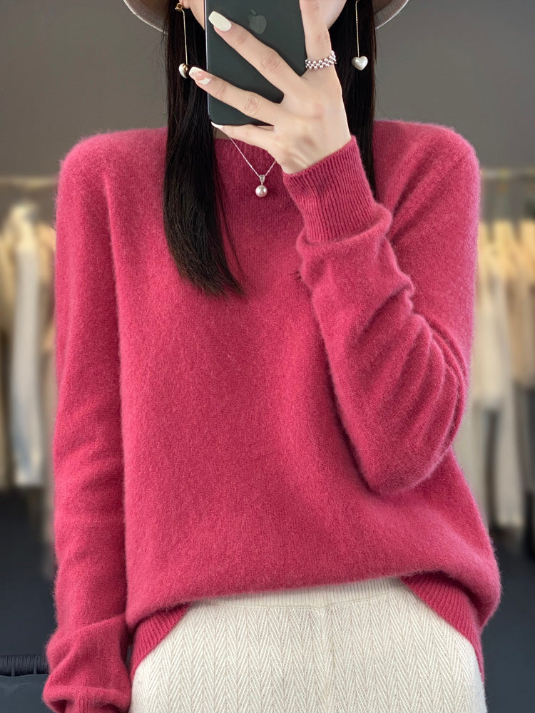 Warm women's round neck sweater, relaxed fit pullover knit top for cozy wear.