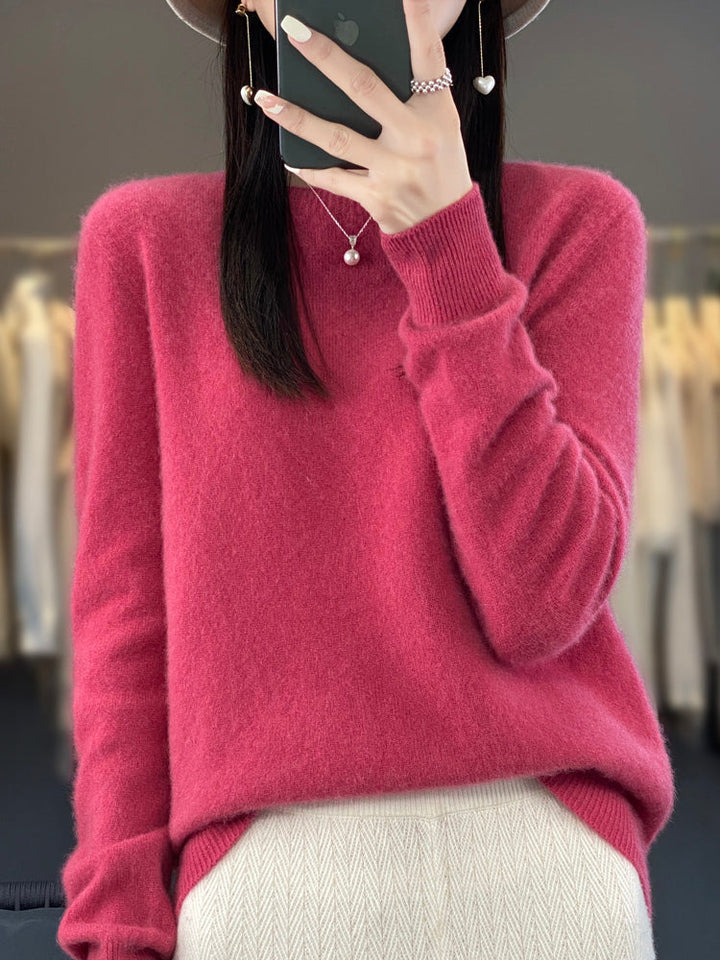 Warm women's round neck sweater, relaxed fit pullover knit top for cozy wear.