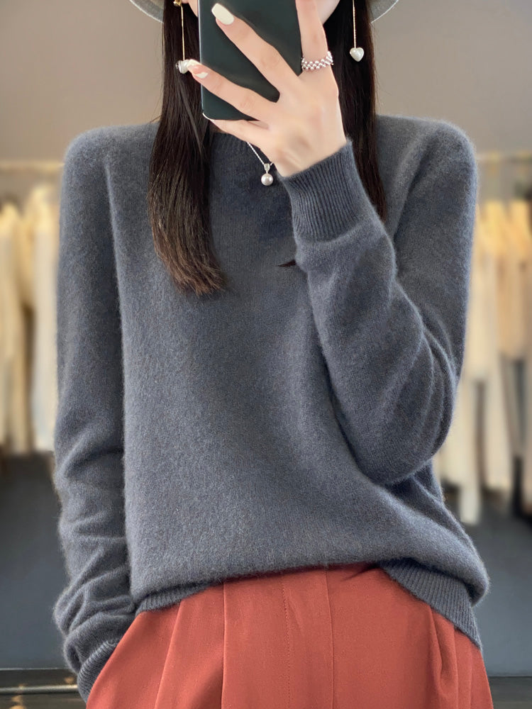 Soft touch women's round neck sweater, relaxed fit pullover for ultimate comfort.