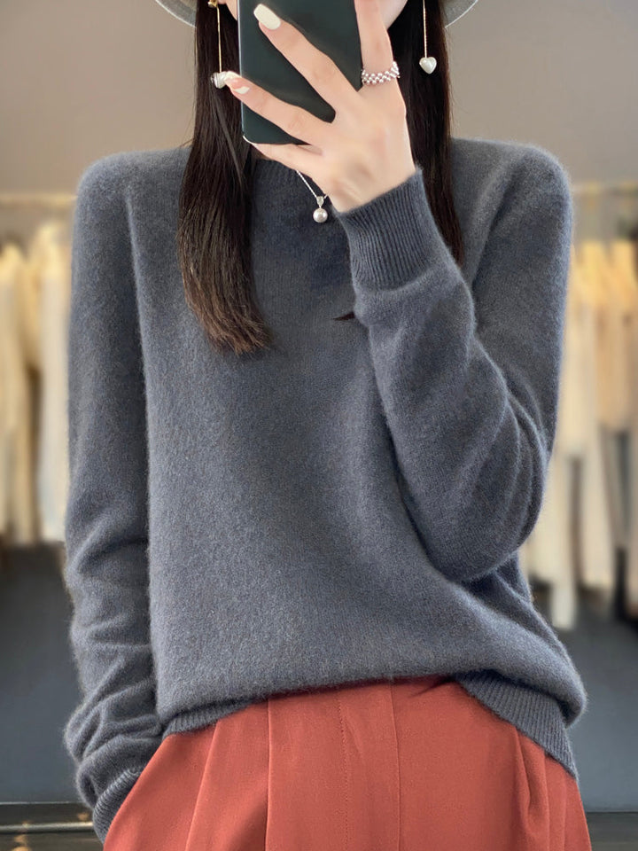 Soft touch women's round neck sweater, relaxed fit pullover for ultimate comfort.