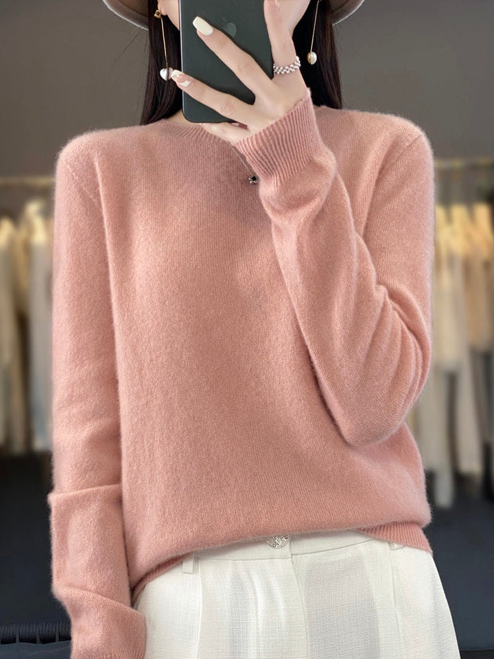 Chic women's crewneck pullover sweater, essential knitwear for easy layering and warmth.