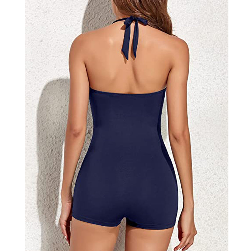 Confident women's swimwear: a flattering ruched halter one-piece with a modest boyleg for resort wear.