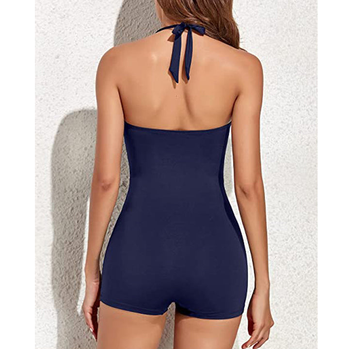 Confident women's swimwear: a flattering ruched halter one-piece with a modest boyleg for resort wear.