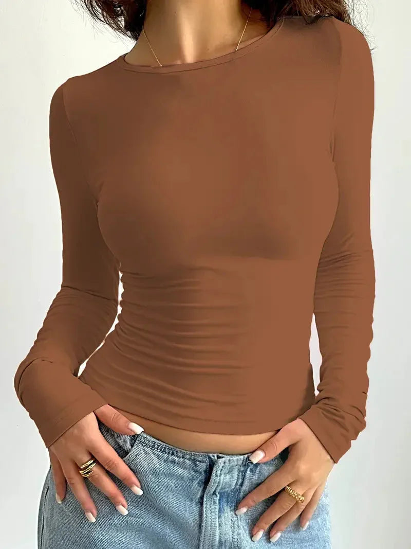 Chic slim fit ruched long sleeve top for women. Great for layering or as a stand-alone piece in any everyday outfit.