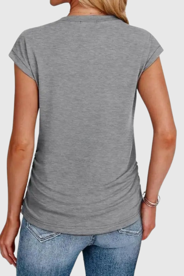 Stylish women's casual tunic top with ruched side and short sleeves. Perfect for summer fashion and warm weather.