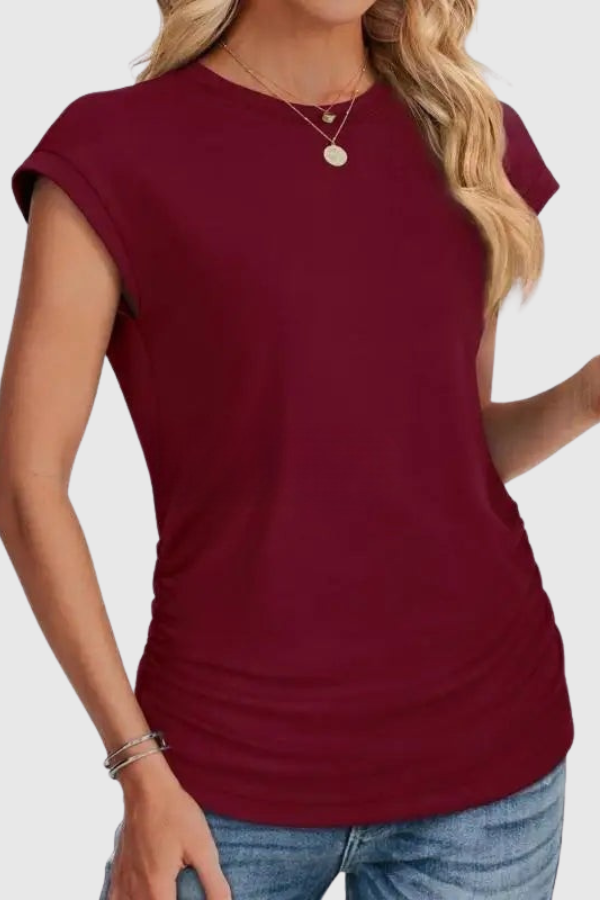 Casual women's short sleeve tunic top, ruched side detail, crew neck. Versatile and stylish for any day.