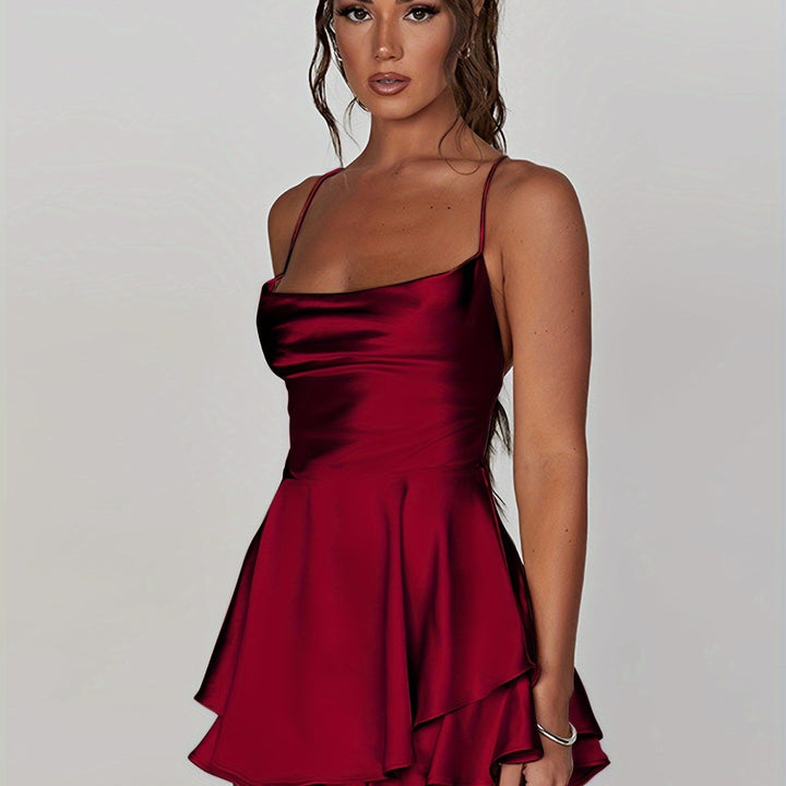 Sophisticated women's cocktail dress: ruched bodice mini with a tiered skirt, adjustable straps.