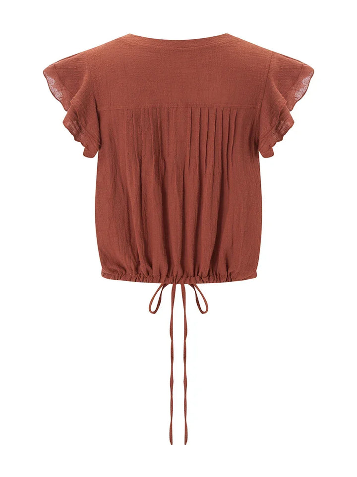 Chic women's short sleeve ruffle crop top, lightweight and perfect for beach & summer fashion.