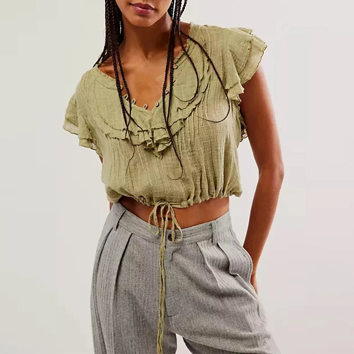 Stylish women's short sleeve ruffle front crop top for trendy summer and beachwear.