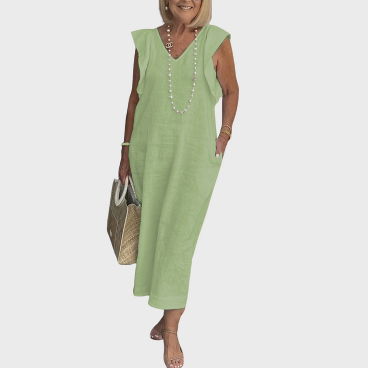 Resort wear women's maxi dress: sleeveless, V-neck, ruffle shoulder, with pockets. Ideal for beach outfits.