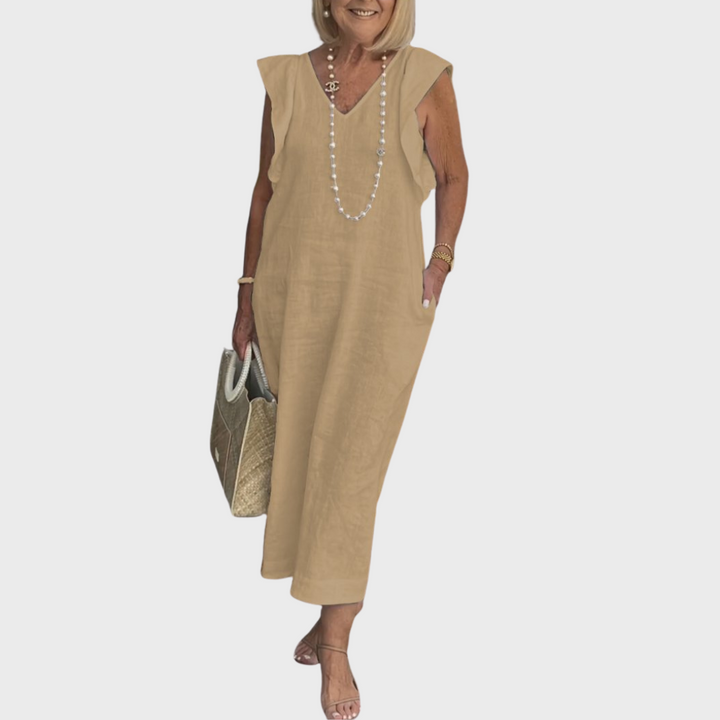 Flowy elegant women's V-neck sleeveless maxi dress, featuring ruffle shoulders and handy side pockets.