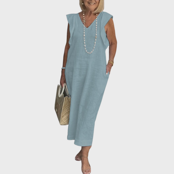 Casual comfortable women's maxi dress with V-neck, sleeveless design, ruffle shoulders, and useful pockets.