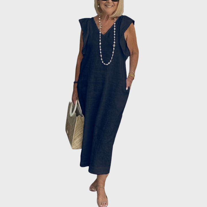 Elegant women's sleeveless V-neck maxi dress featuring ruffle shoulders and pockets, great for beach or casual wear.