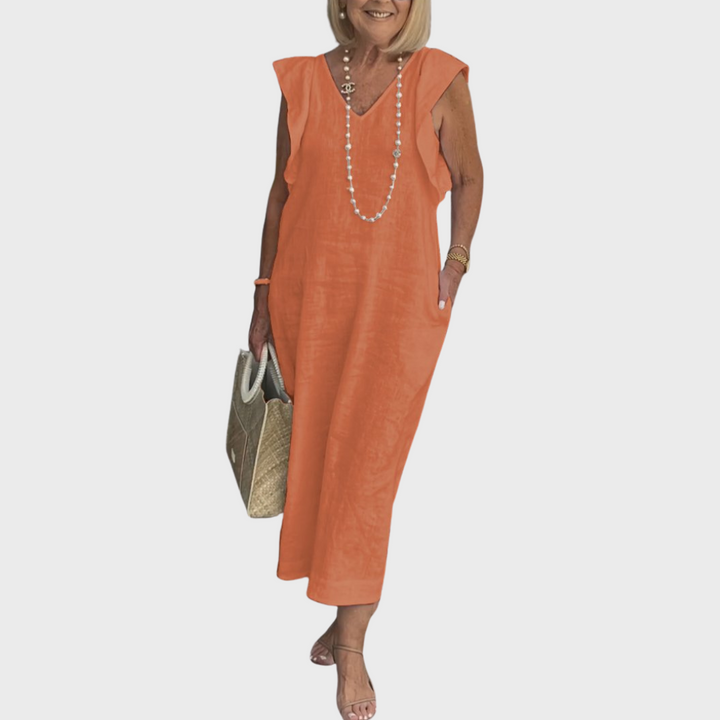 Summer women's maxi dress with ruffle shoulders, V-neck, sleeveless design, and functional pockets.