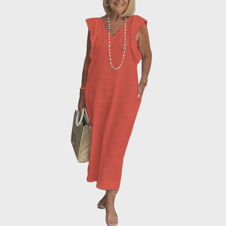 Trendy V-neck sleeveless maxi dress for women, featuring stylish ruffle shoulders and convenient pockets.