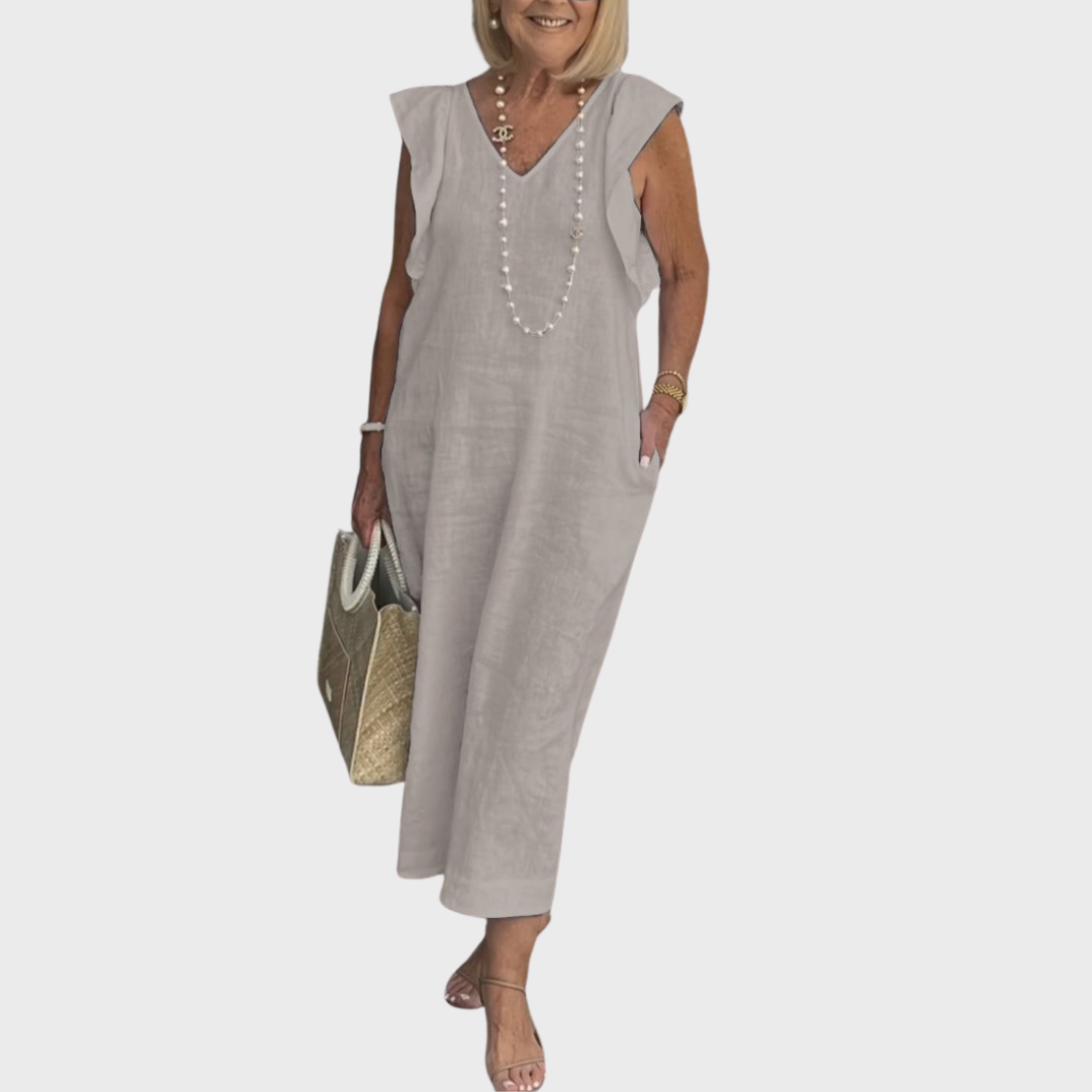 Versatile women's summer maxi dress, sleeveless V-neck with ruffle details and essential pockets.