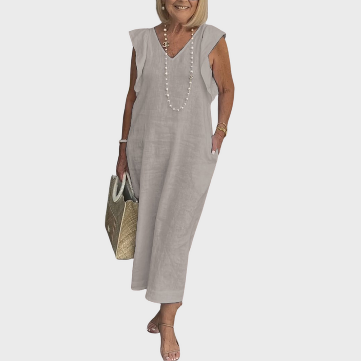 Versatile women's summer maxi dress, sleeveless V-neck with ruffle details and essential pockets.