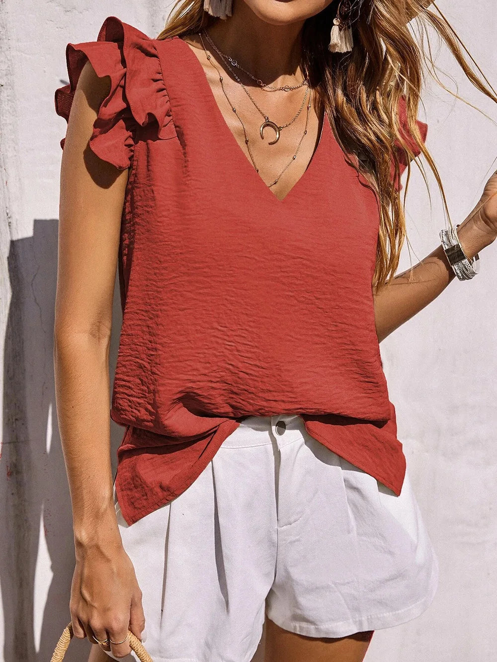 Comfortable women's summer top featuring chic ruffle sleeves and a flattering V-neck design.