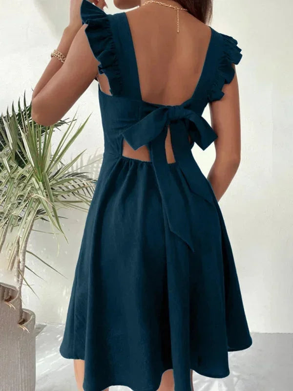 Trendy A-line mini dress with ruffle straps & a charming bow back, ideal for women's summer parties.