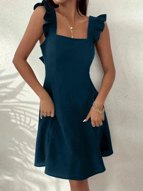 Women's casual mini dress, A-line style, with cute ruffle straps and an attractive bow back detail.