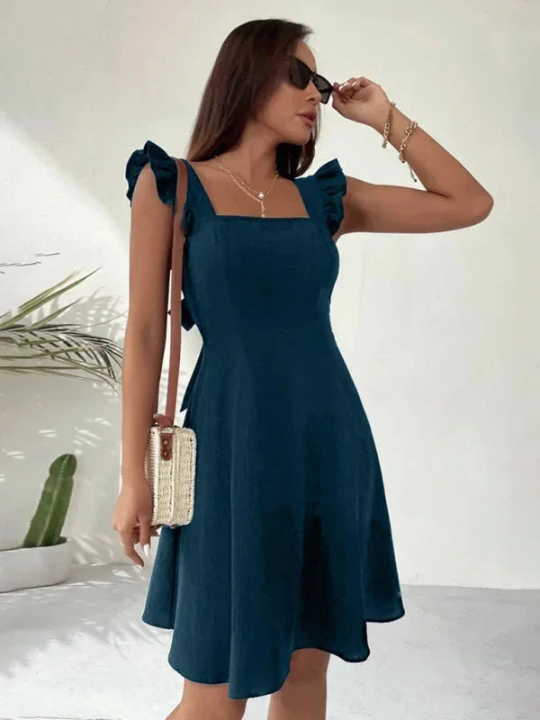 Versatile women's mini dress: A-line, ruffle straps, and a lovely bow back for any occasion.