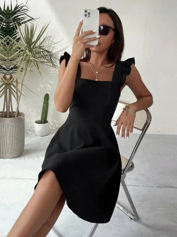 Women's party-ready mini dress: A-line silhouette, ruffle straps, and an elegant bow accent on the back.