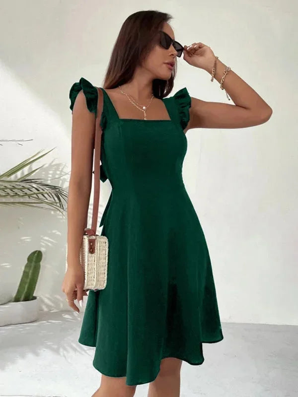 Versatile square neck mini dress with delicate ruffle straps and a charming back bow design.