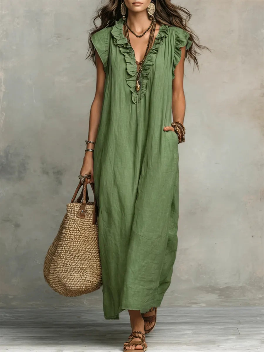 Casual bohemian women's maxi dress with V-neck, flutter sleeves, ruffles & pockets; ideal for summer vacations.
