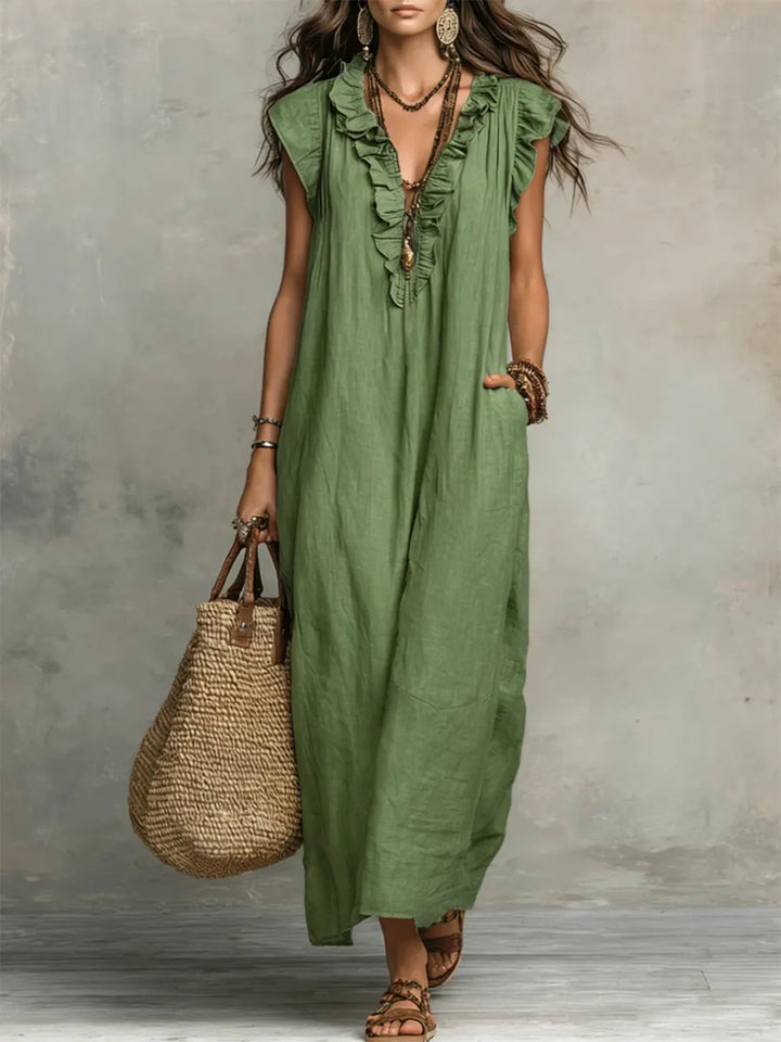 Casual bohemian women's maxi dress with V-neck, flutter sleeves, ruffles & pockets; ideal for summer vacations.