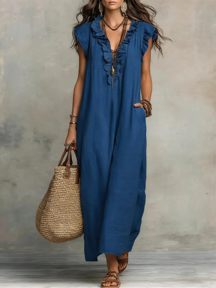 Comfortable flowy women's maxi dress featuring ruffles, V-neck, flutter sleeves, and practical pockets.