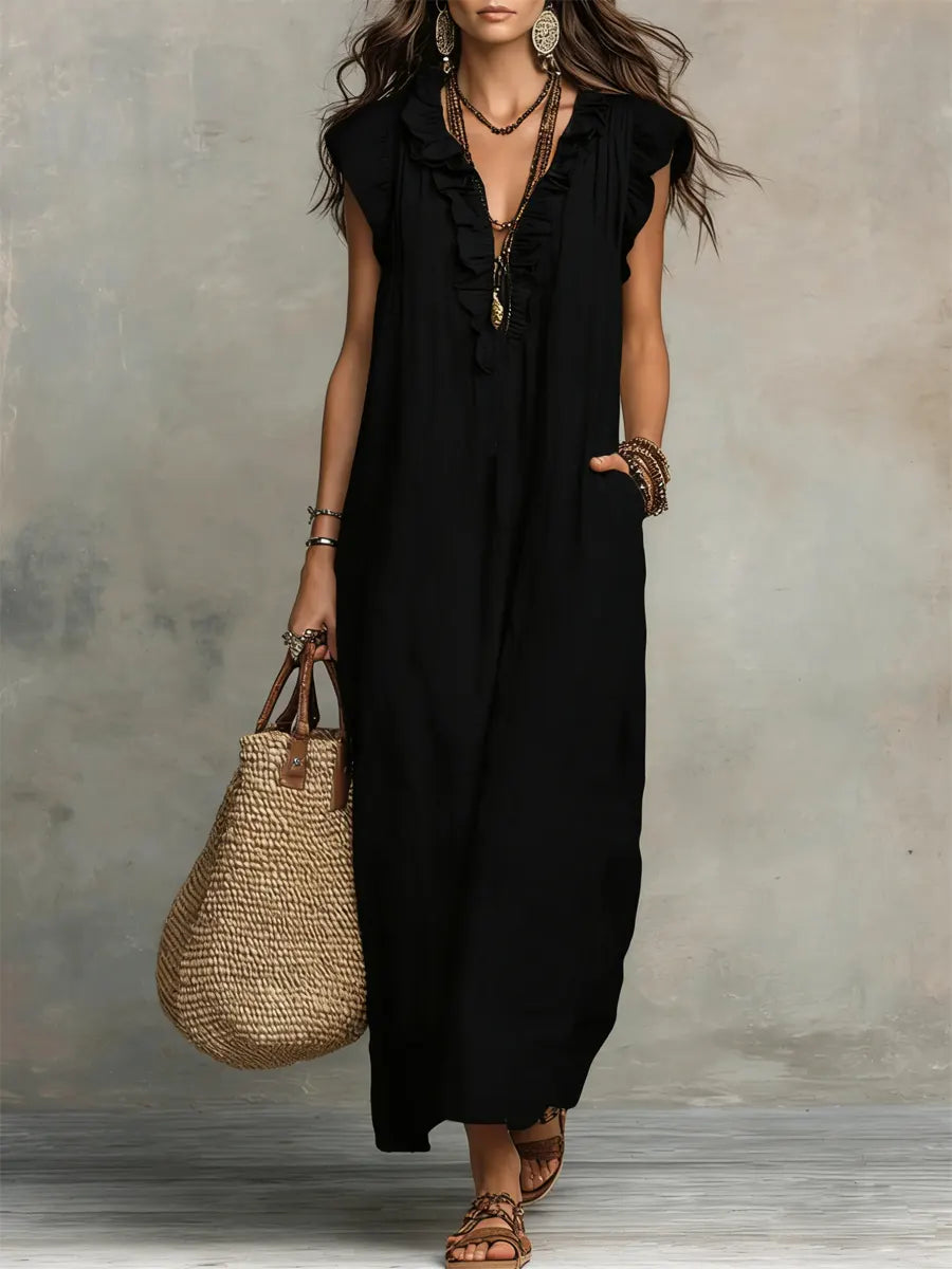 Bohemian style women's ruffle V-neck maxi dress with flutter sleeves & pockets, great for beach vacations.