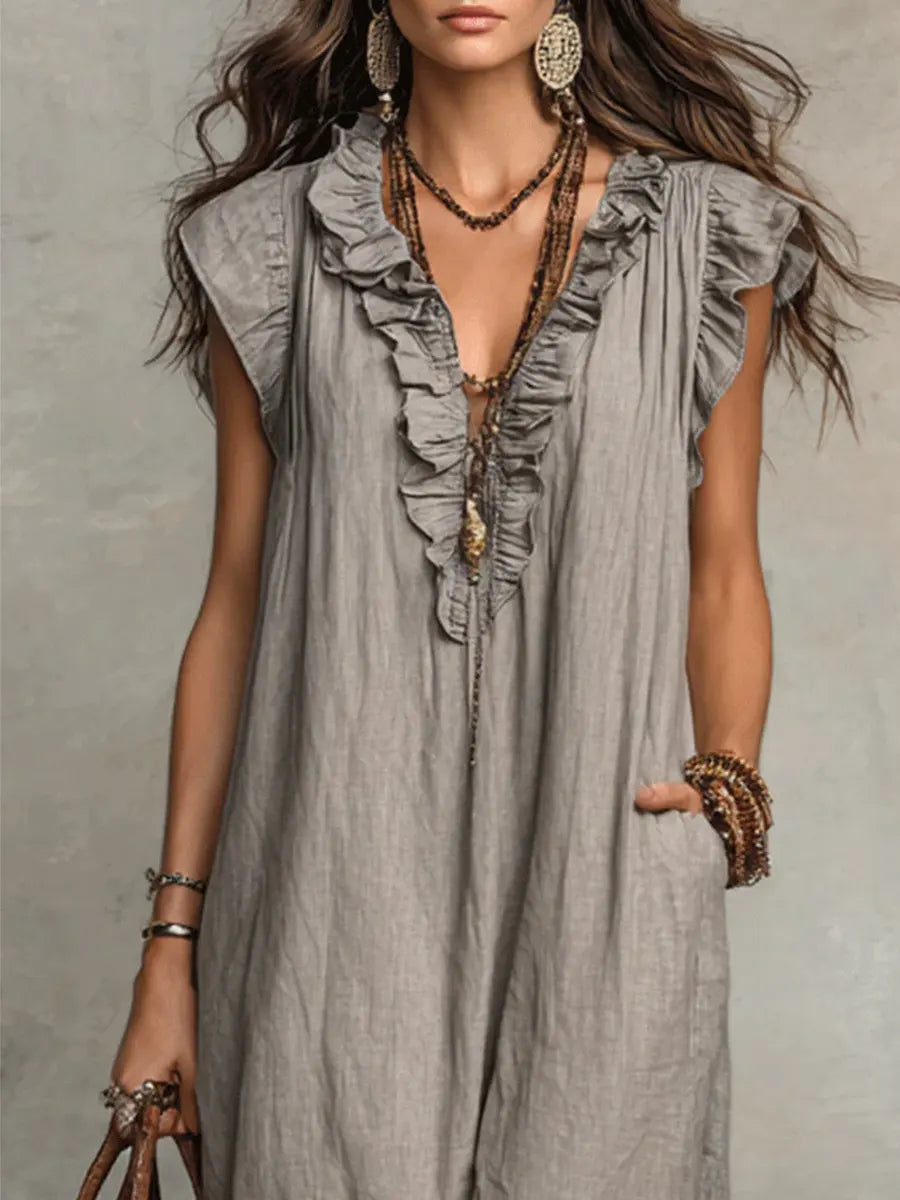 Casual women's summer maxi dress with a flattering ruffle V-neck, comfortable flutter sleeves, and practical pockets.