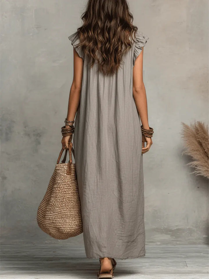 Elegant & comfortable women's flutter sleeve maxi dress with V-neck, ruffles, & pockets, ideal for warm days.