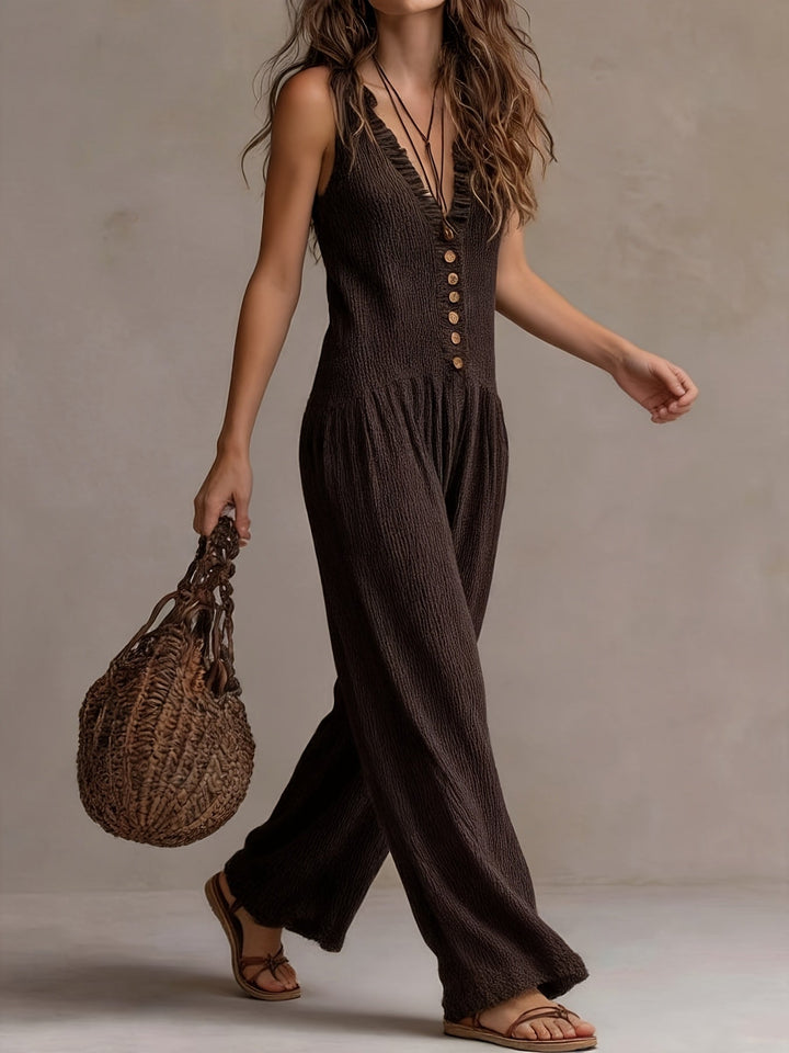 Women's ruffle V-neck smocked wide leg jumpsuit, a stylish summer outfit.