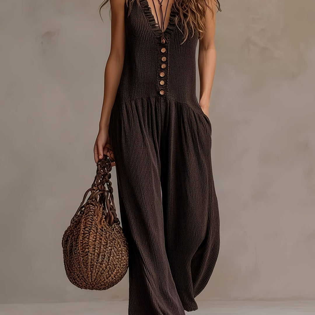 Women's sleeveless jumpsuit, V-neck, ruffle trim, and smocked wide leg for bohemian style.