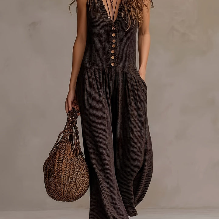 Women's sleeveless jumpsuit, V-neck, ruffle trim, and smocked wide leg for bohemian style.