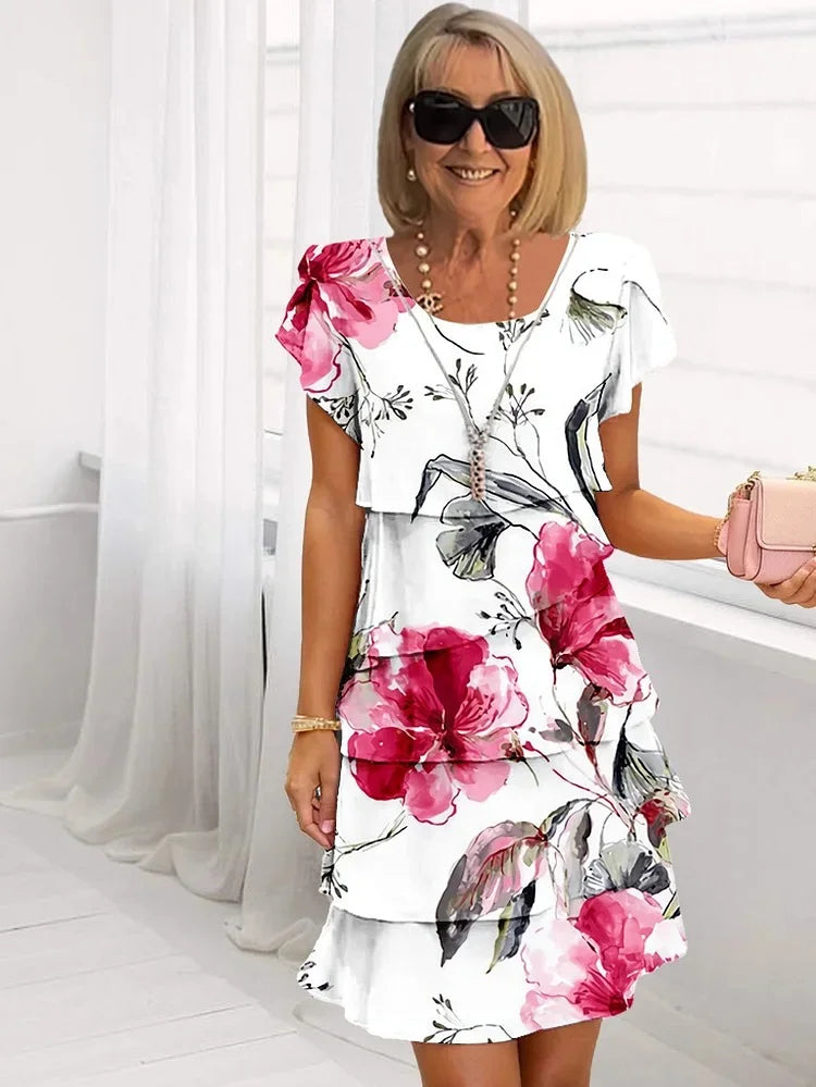 Women's ruffled floral pleated midi dress with adjustable straps, perfect for summer parties or elegant day wear.