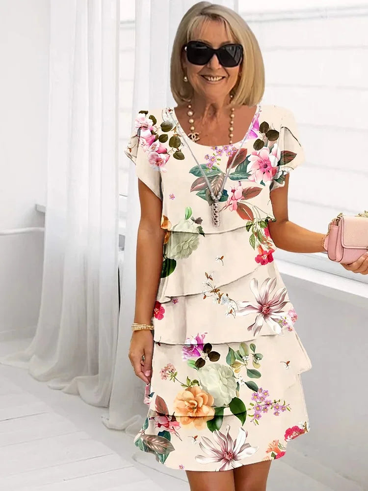 Stylish women's ruffled floral midi dress, with delicate pleats and adjustable straps, a versatile summer fashion piece.