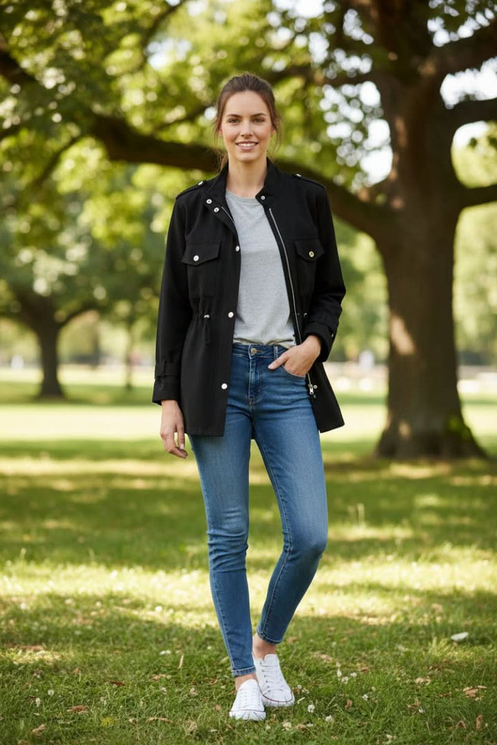 Modern women's utility jacket, perfect for street style. Features a rugged design & fashionable open back for versatile layering.