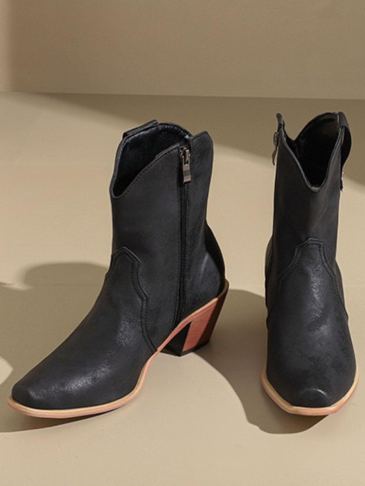 Rustic black women's western boots. Stylish snip toe cowgirl boots featuring a sturdy block heel and wide calf fit.