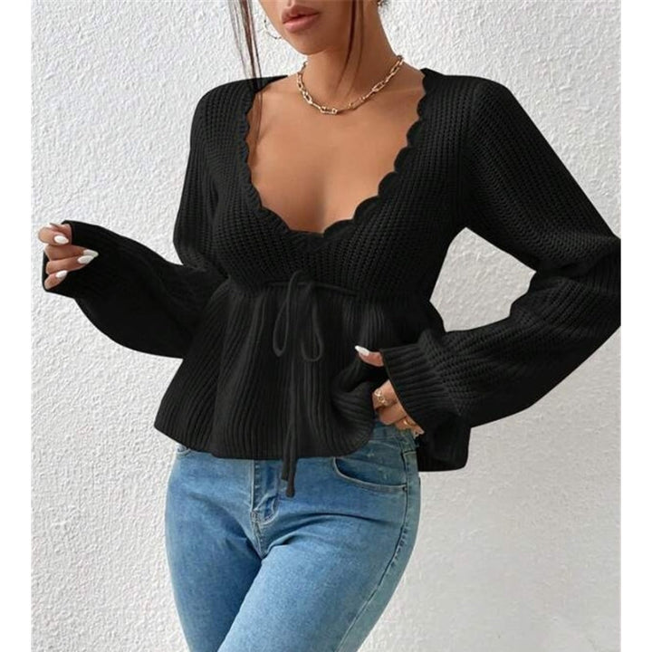 Cream knit top with scallop neck and tie-front. Women's long sleeve, lightweight summer fashion.