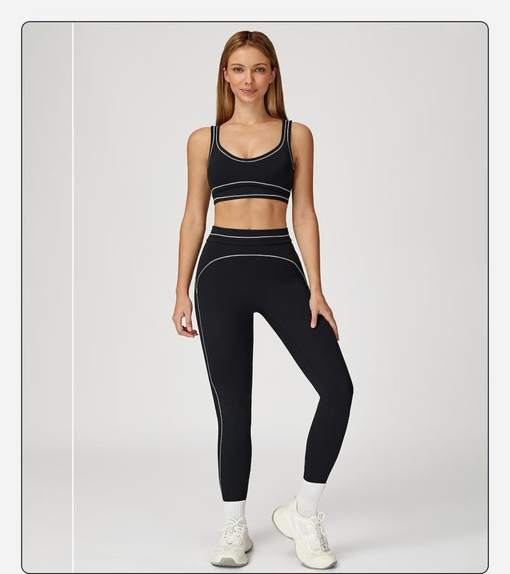 Woman stretching in a studio wearing the teal Women's Sculpting Activewear two piece set