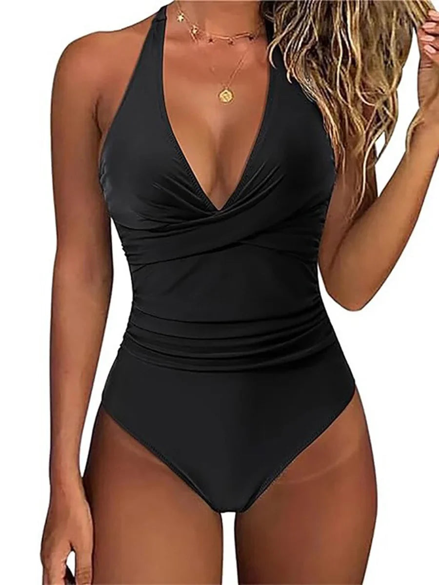 Full view of a women's one-piece sculpting swimsuit, featuring halter neck and tummy control.