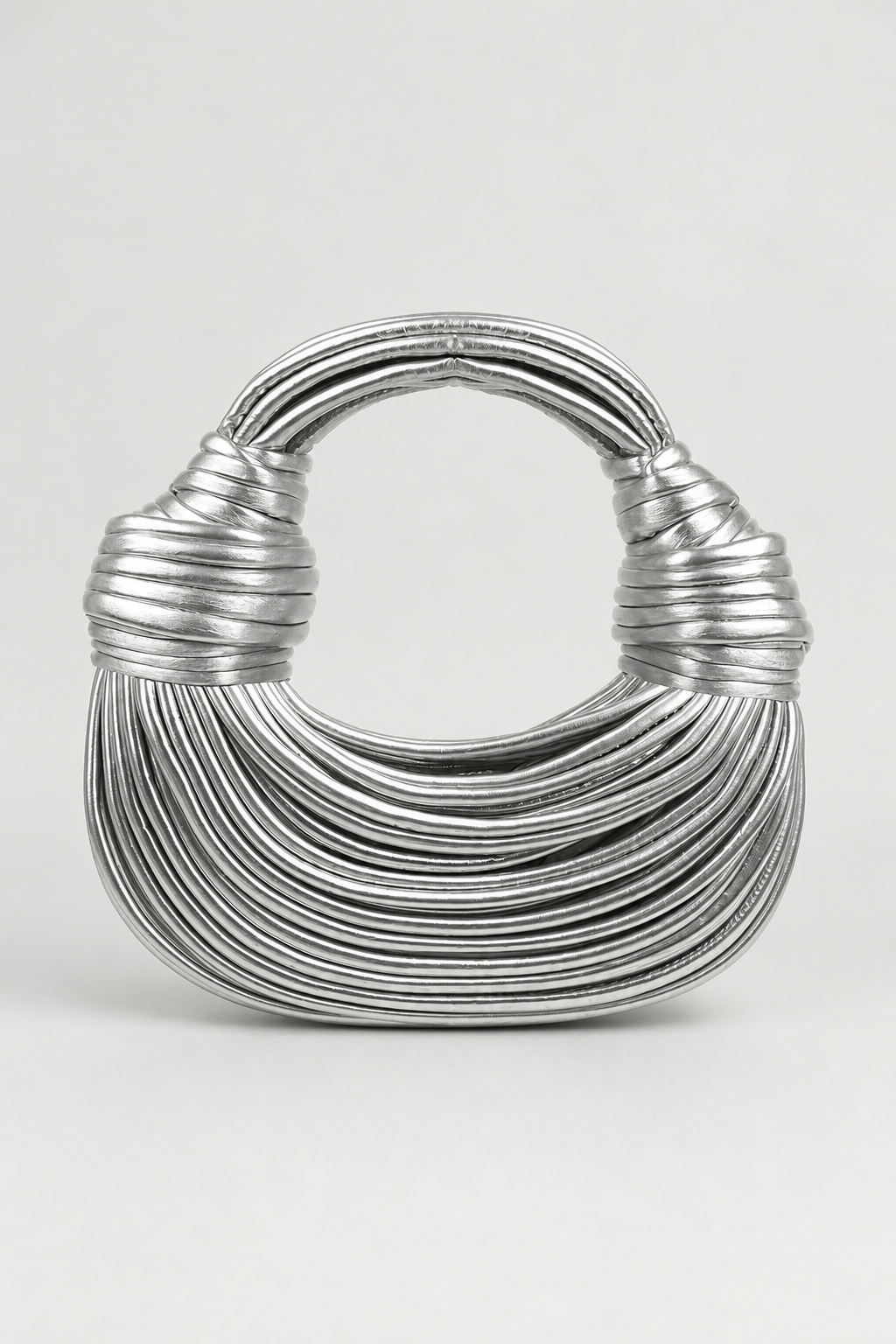 Elegant women's crescent shoulder bag with coiled loop handle. A versatile and stylish accessory for any outfit.