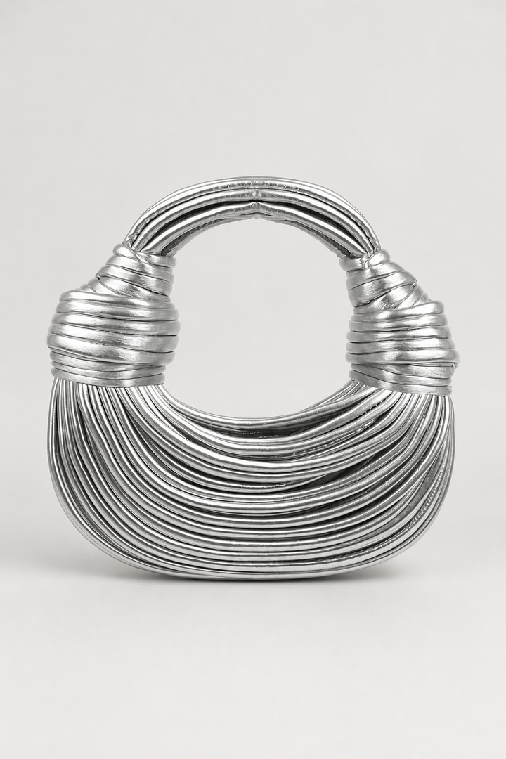 Elegant women's crescent shoulder bag with coiled loop handle. A versatile and stylish accessory for any outfit.