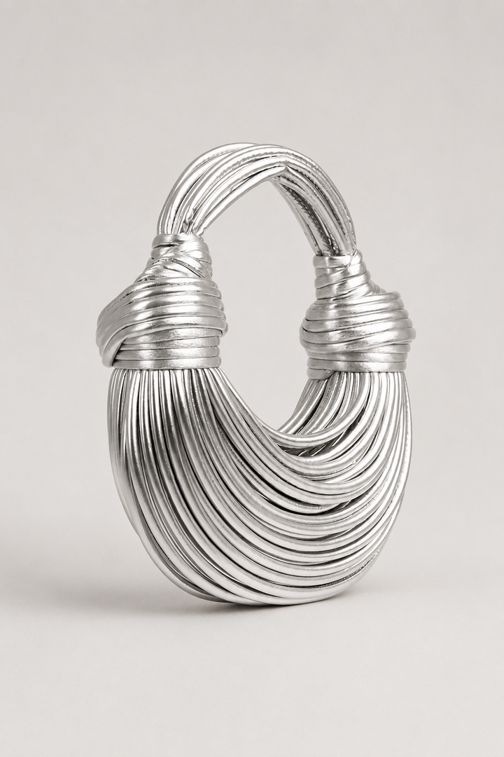 Women's versatile crescent shoulder bag with unique coiled loop handle. Perfect elegant and lightweight everyday accessory.