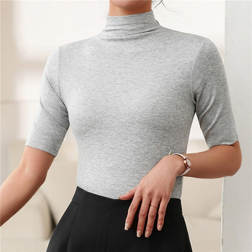 Elegant women's seamless slim fit turtleneck top, perfect as a versatile layering piece or stylish fashion sweater.