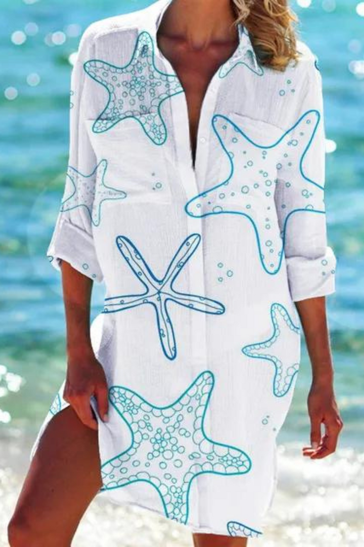 Women's seashell coral print button-down swimsuit cover-up for resort vacation.