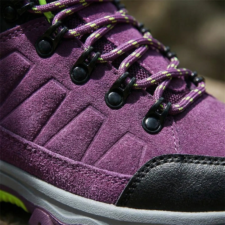 Water-repellent women's hiking boots designed for all-terrain adventure. Durable outdoor footwear with great traction.
